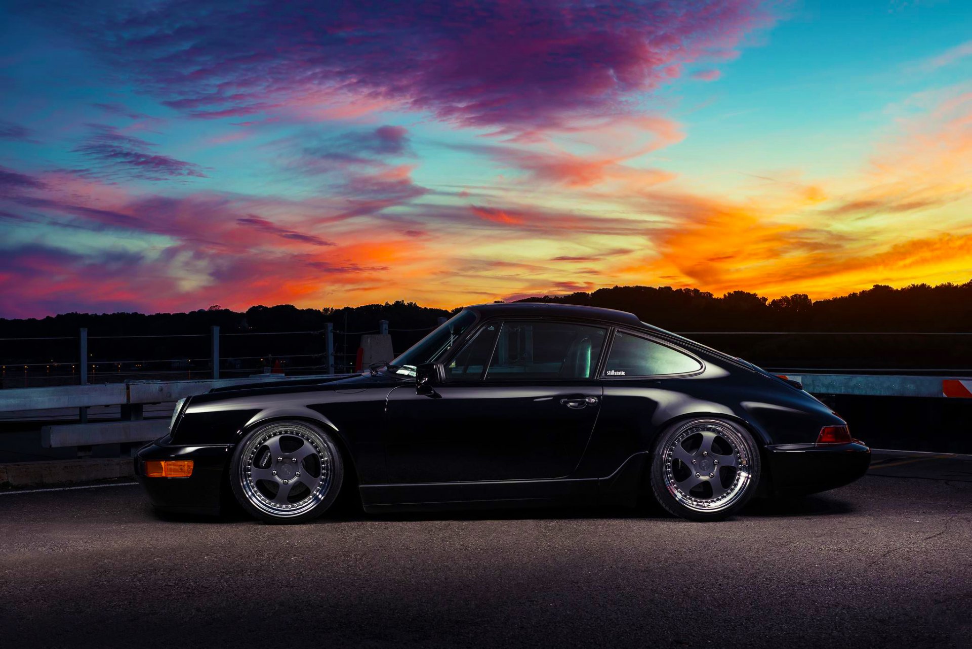 porsche 911 carrera classic black side sunset