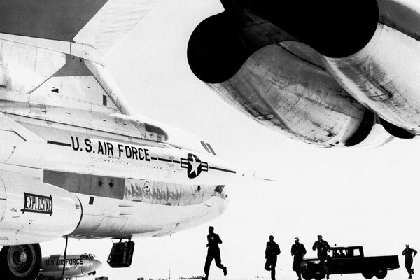 The US Air Force at the airfield near the plane