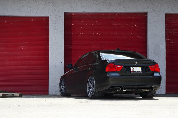 Parked black BMW E90 3 series