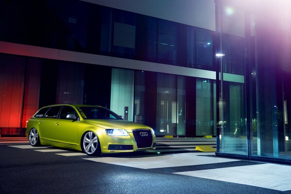 Green Audi parked in front of the house