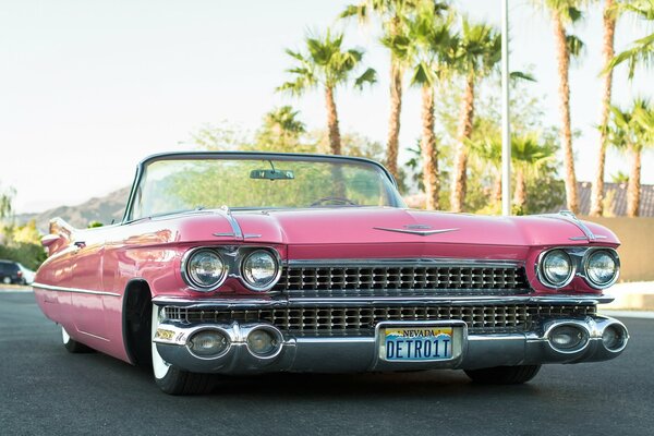 Cadillac convertible convertible 1959. Pink under the palm trees