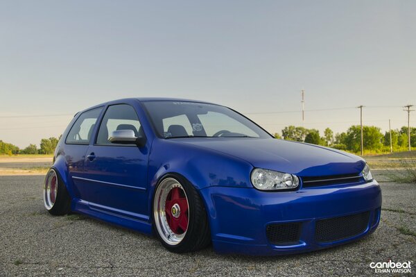 Understated blue Volkswagen Golf, on cool wheels