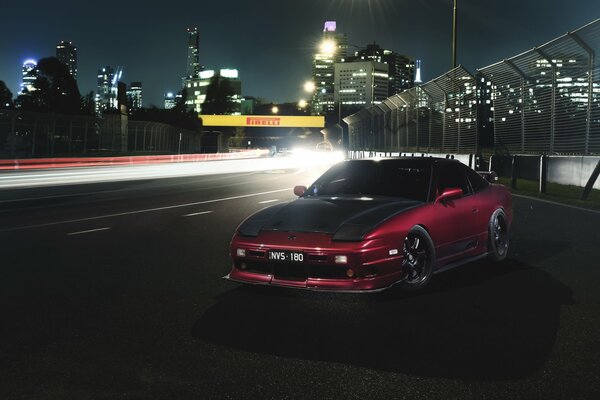 Nissan 180sx car on the background of a night city