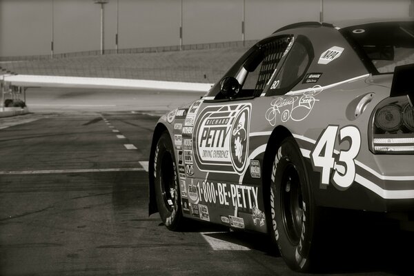 Black and white chevrolet nascar on the track