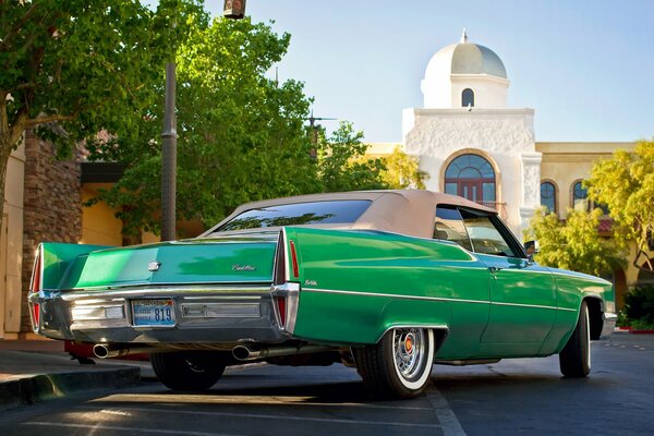 Classic retro green convertible with roof installed