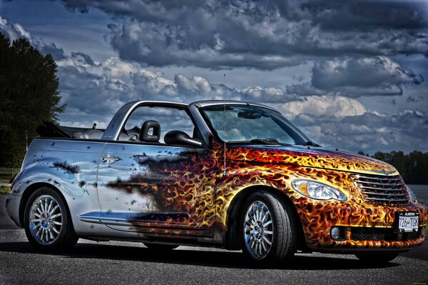 Convertible with airbrushing of the burning half of the body