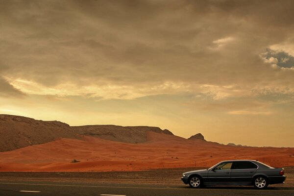 A deserted desert and a lonely car