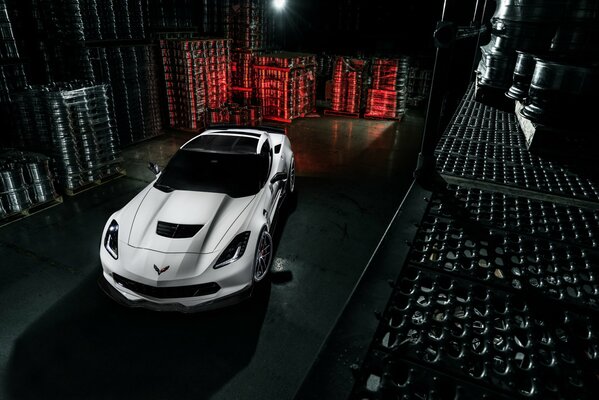 Corvette at night at the processing plant