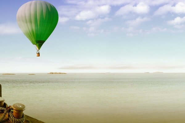 A balloon flies over the water