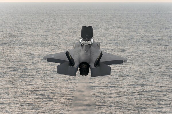 Lockheed Martin f-35B fighter jet over water