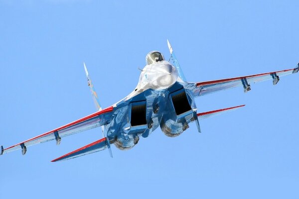 Su-27 fighter jet on a blue sky background