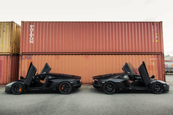 Black lamborghini near the container