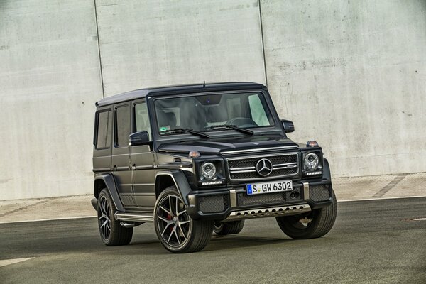 Mercedes car on the background of a gray wall