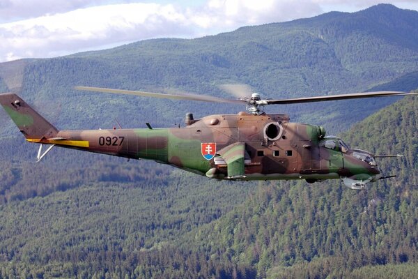 Soviet helicopter over spruce forest