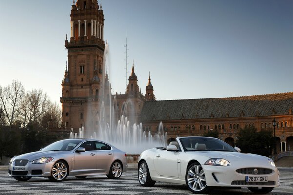 Two convertibles in front of the fountain