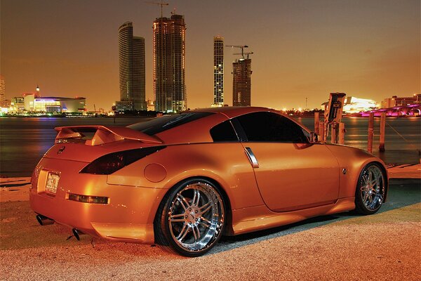 Orange car near the pier