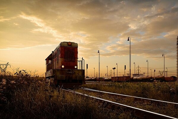 An old - style Soviet-made diesel locomotive can carry up to 50 wagons on its tail