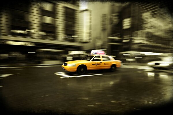 Dynamisches Foto. Taxi in New York City unterwegs