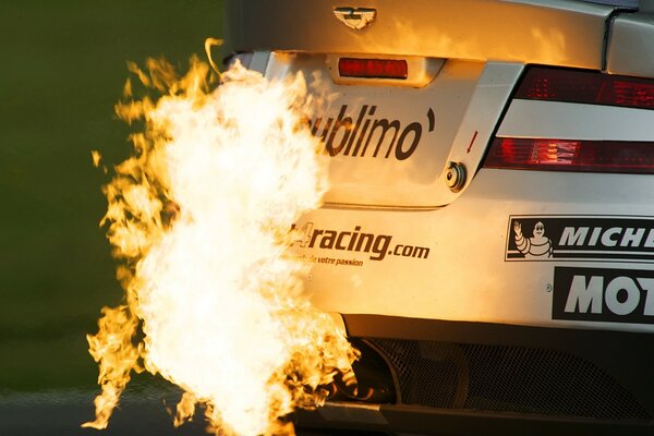 Exhaust of fire by an Aston Martin car