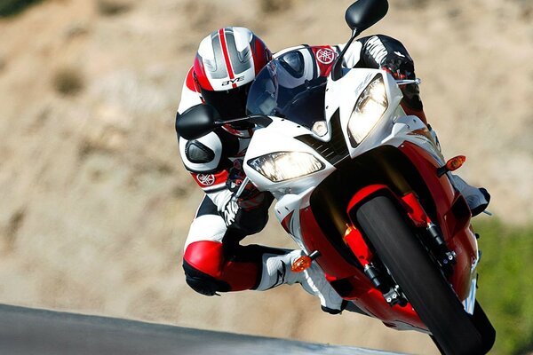 A motorcyclist rushes on his bike