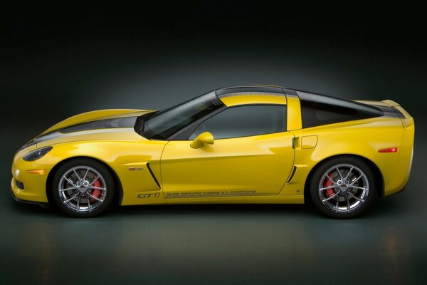 Yellow Chevrolet gt1 corvette on a gray background
