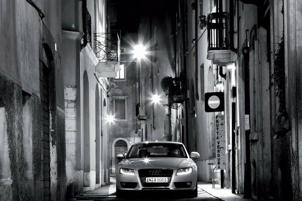 Black and white audi in the night city