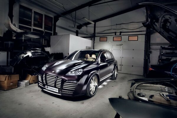 Cayenne Porsche in a gray garage