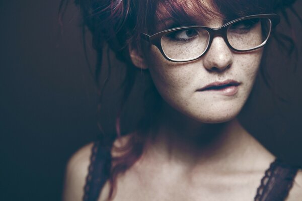 Brunette girl with glasses on her face