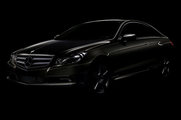 Black mercedes-benz on a very black background