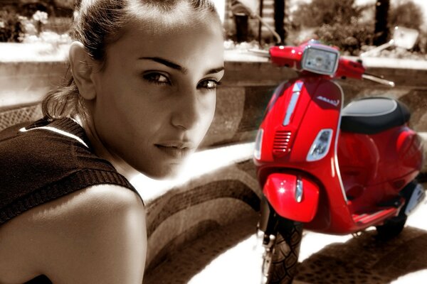 Girl on the background of a motorcycle