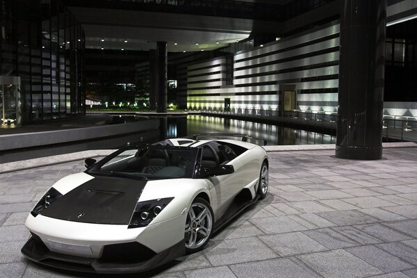 Grey lamborghini supercar in the parking lot