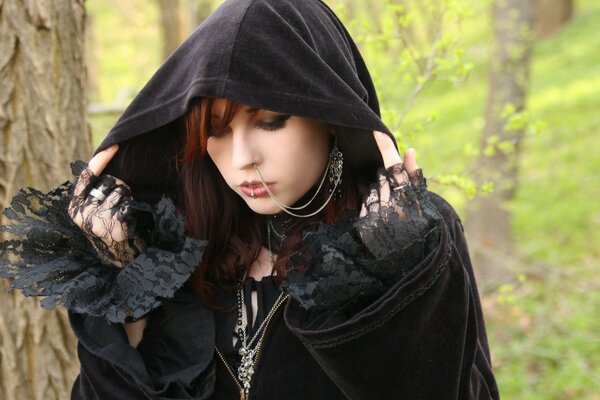 Gothic girl in black with piercing