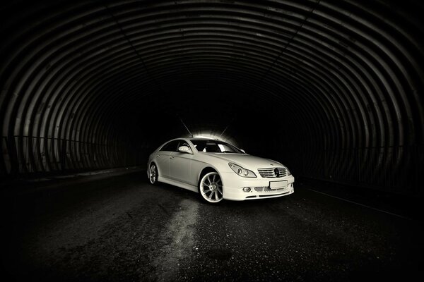 White Mercedes in tunnels side view