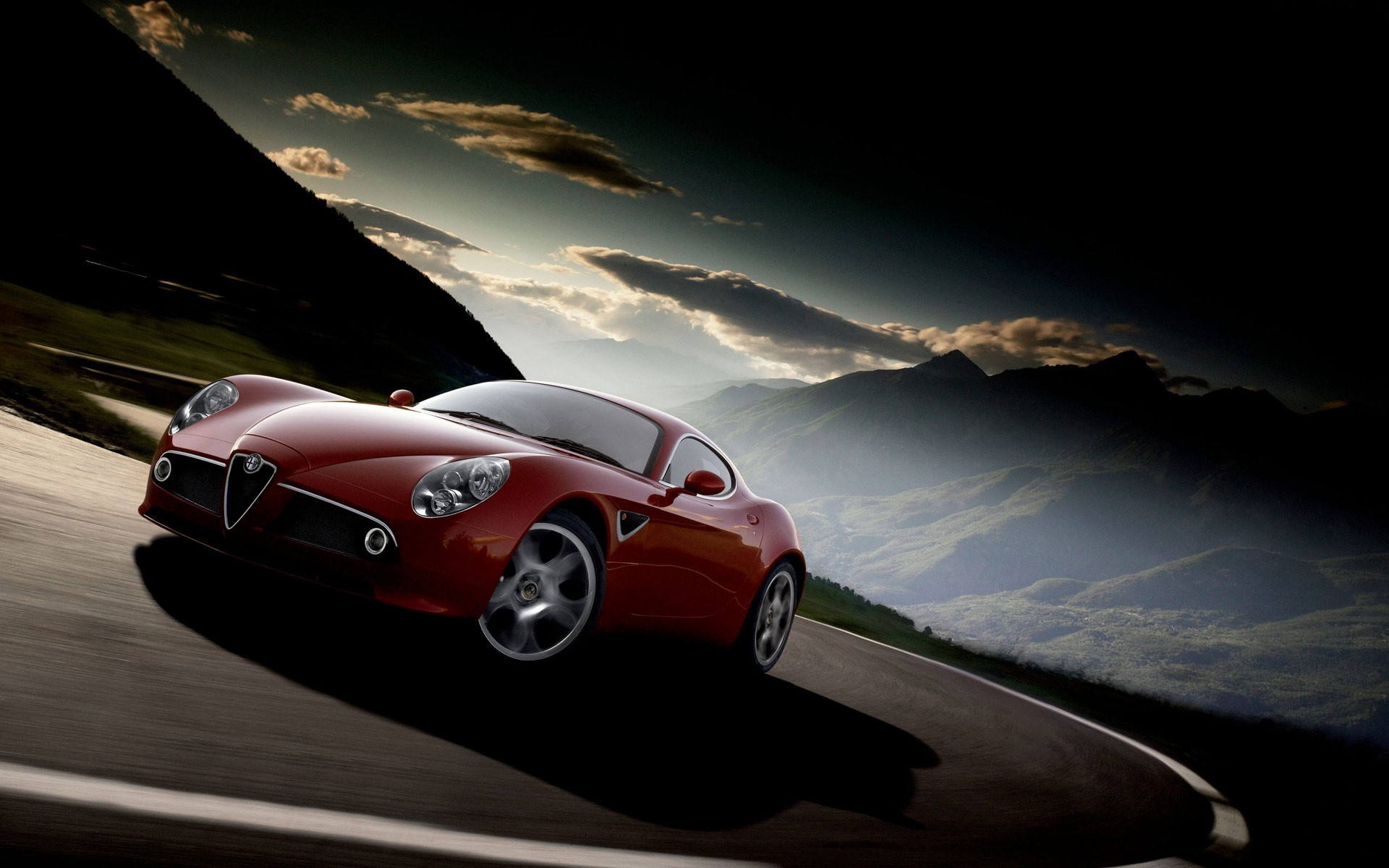 alfa romeo carretera montañas nubes