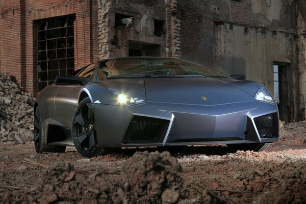 Lamborghini car, reverton, black. Front view. On the ruins