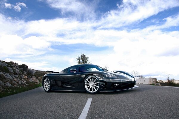 Black Koenigsegg ccx car on sky background