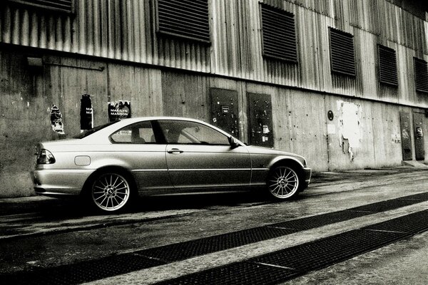 Photo of BMW 3series with noise and black and white filter