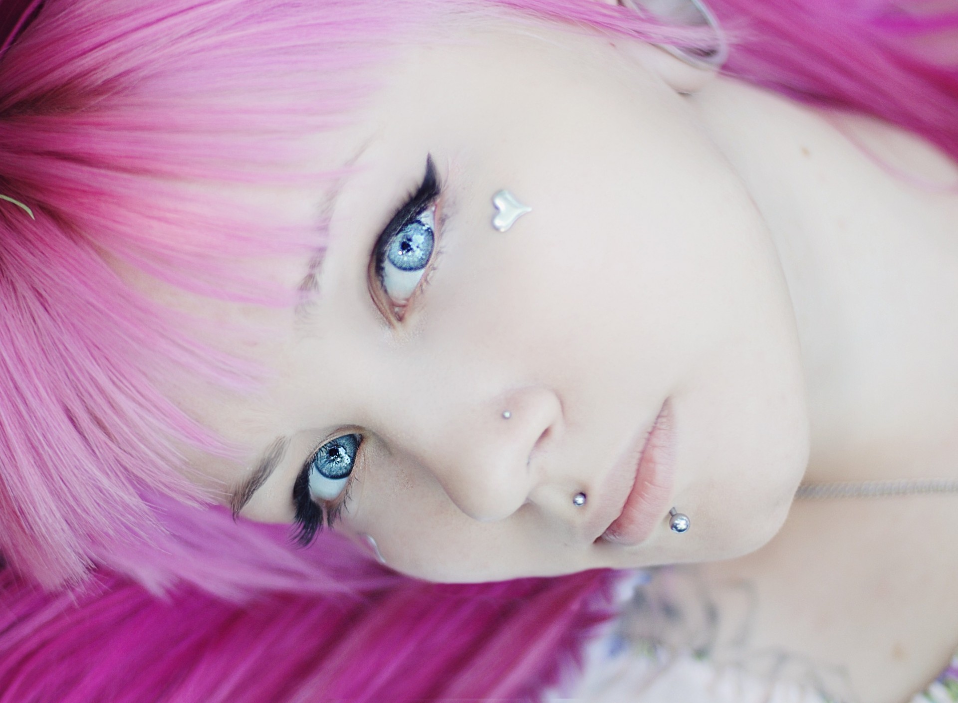 a woman pink hair girl close up face