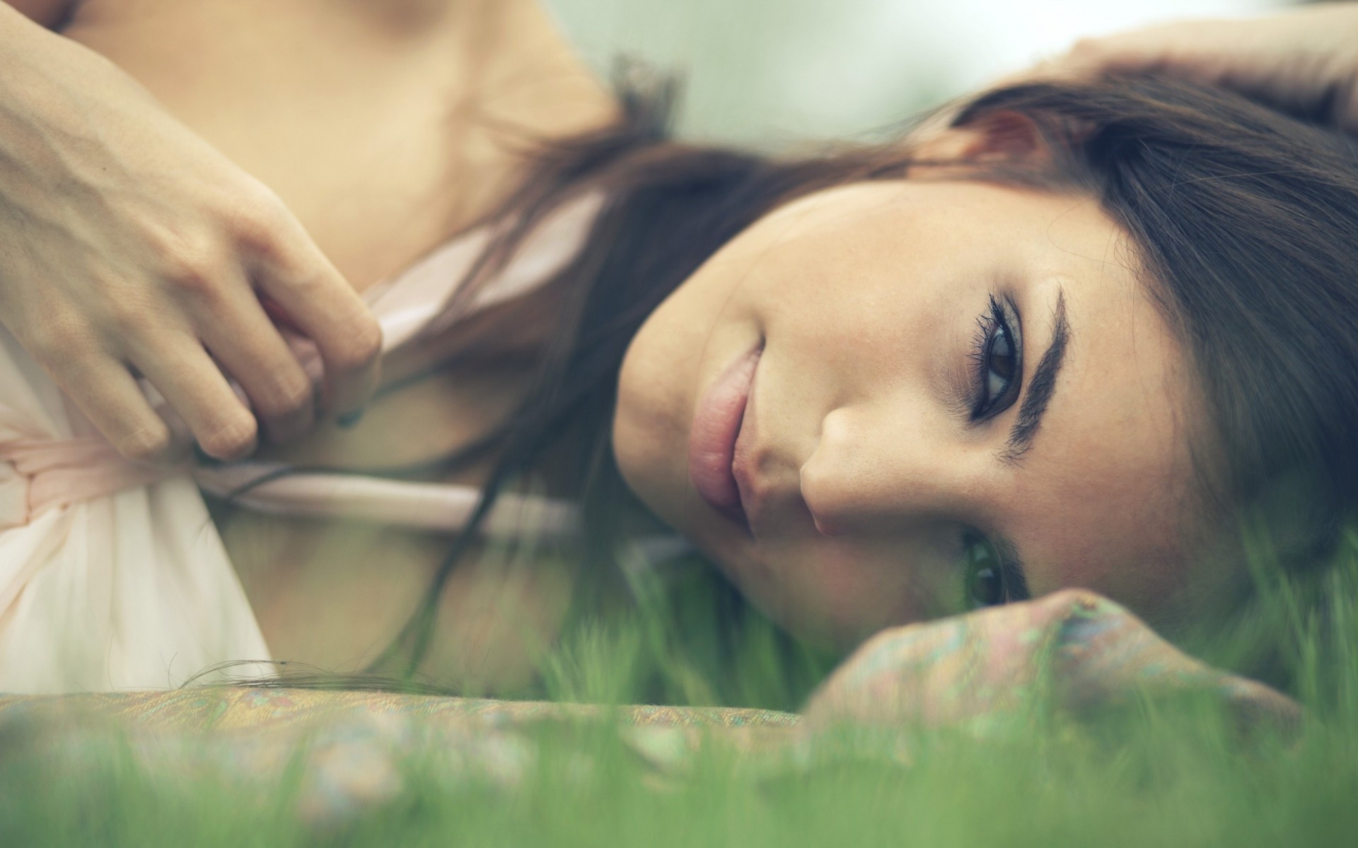 a woman girl brunette grey close up face