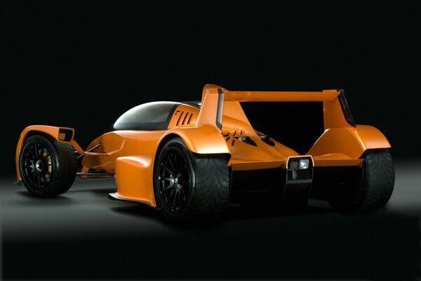 Orange caparo car on black background