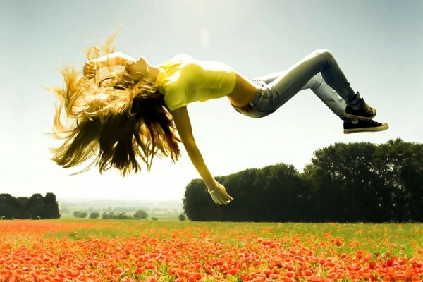 A girl with long hair is lying in the air