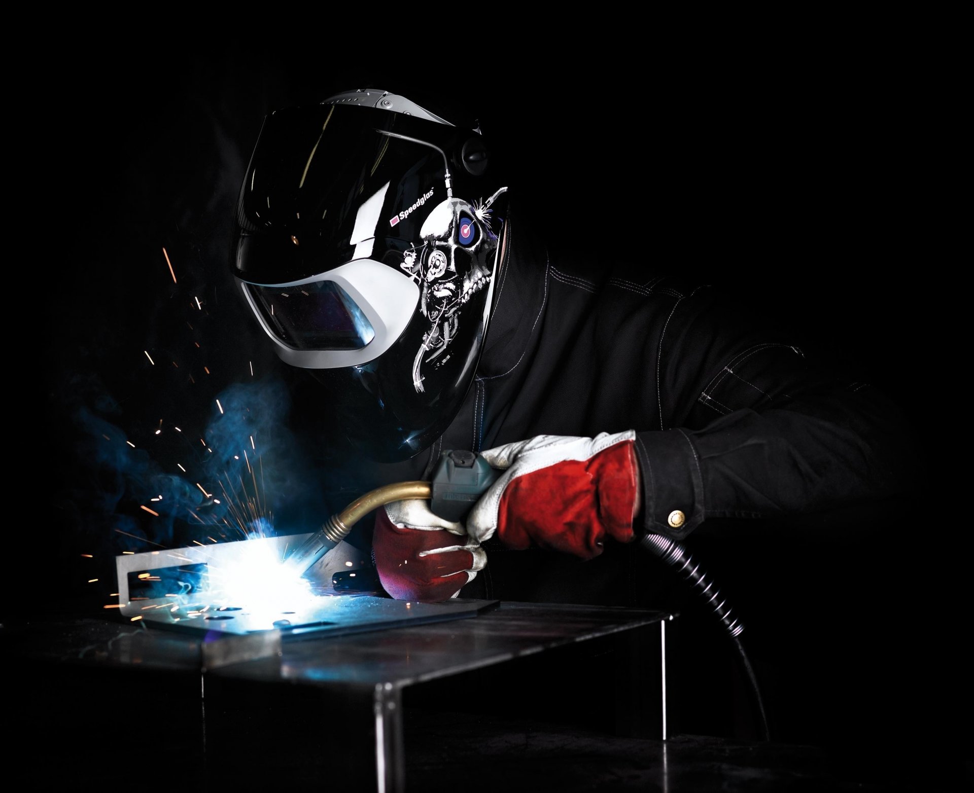 welder male welding mask spark