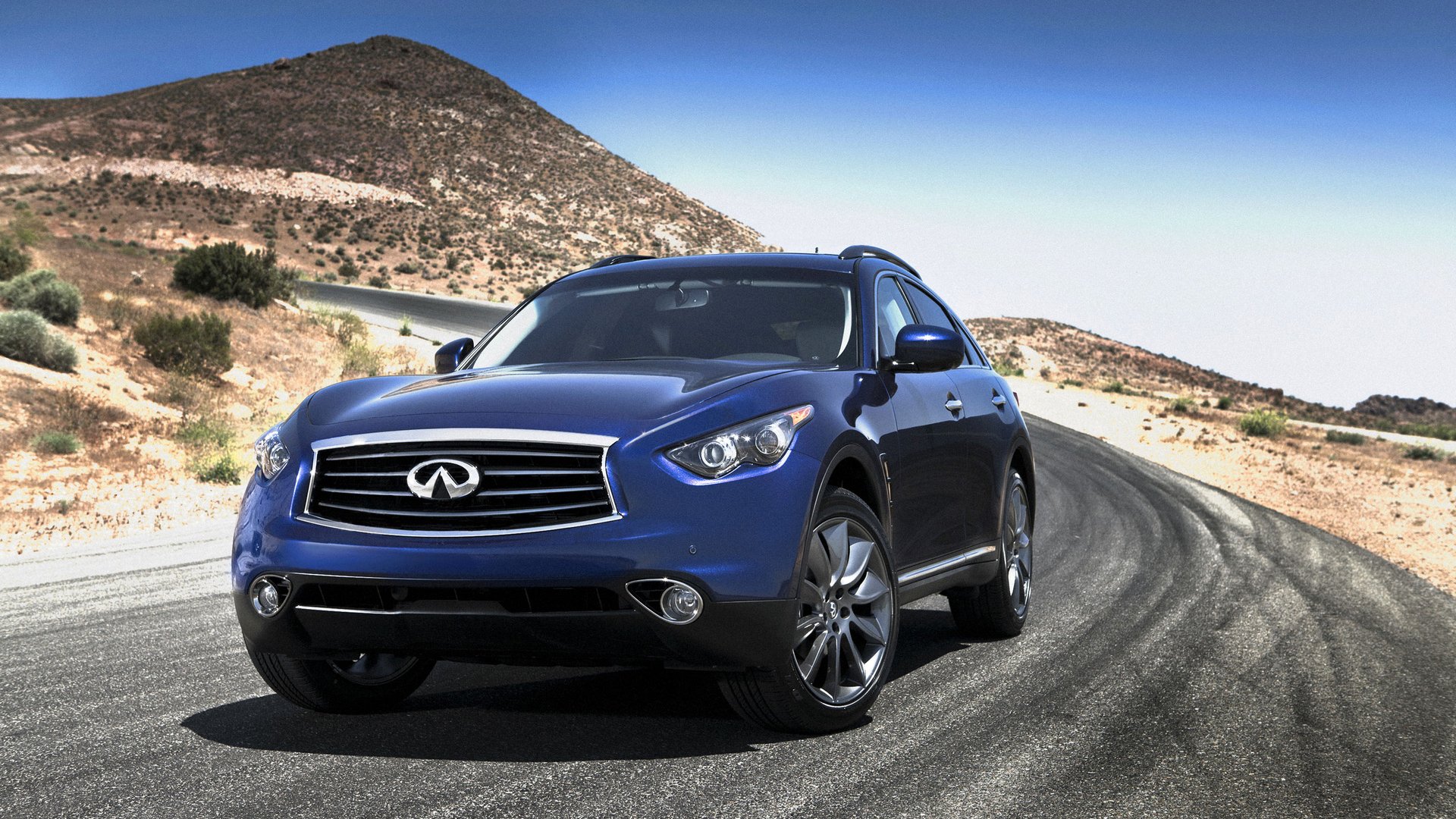 infiniti fx35 suv sport utility vehicle ruote hatchback fari emblema paesaggio montagna strada