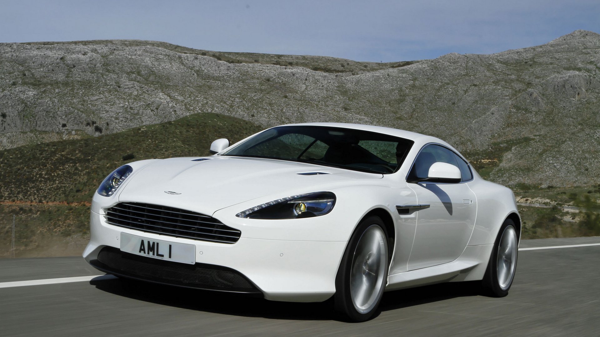 aston martin virage coupe landscape sky mountain road