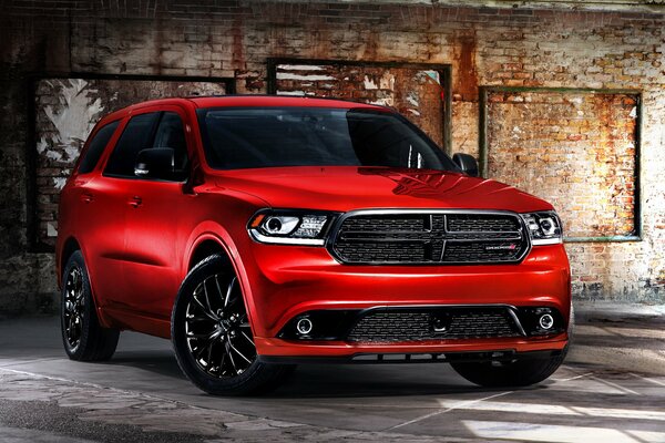 Red car on garage wall background