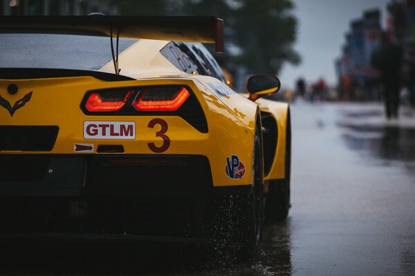 Yellow sports Chevrolet Corvette in the city