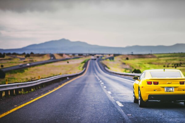Traveling on mountain roads is more interesting in a yellow camaro