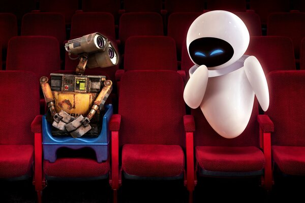 Валли и Ева в кинотеатре на красных креслах