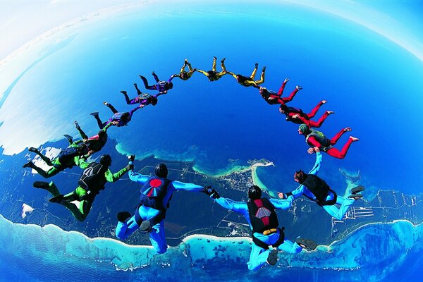 A ring of parachutists high above the ground