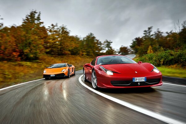 Red Ferrari and yellow Lamborghini on the Italy highway